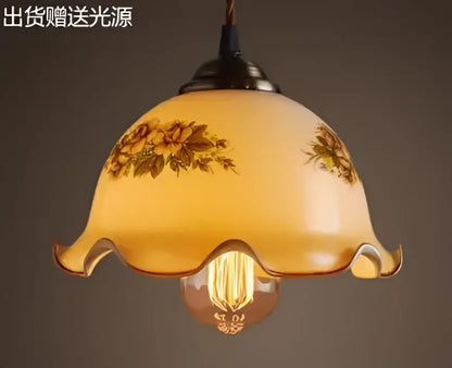 Teal blue glass pendant light with brass hardware for dining room