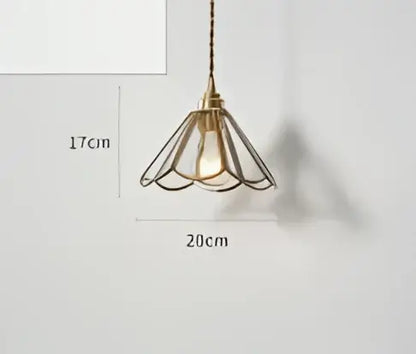 Teal blue glass pendant light with brass hardware for dining room
