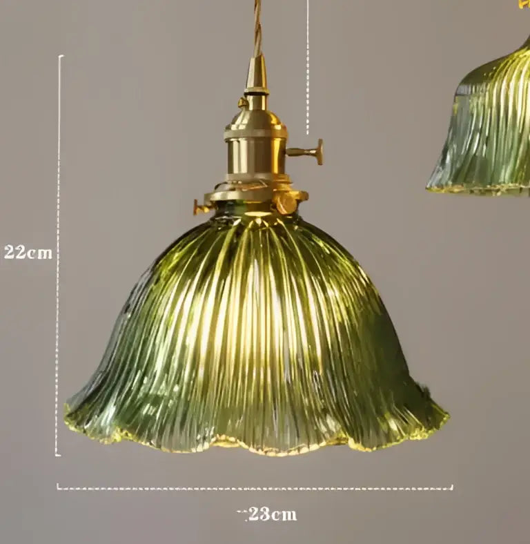 Teal blue glass pendant light with brass hardware for dining room