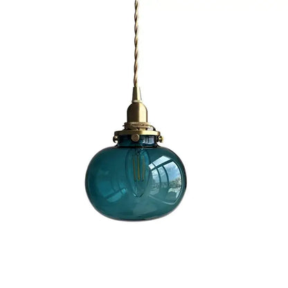 Teal glass ball pendant light with brass hardware for bedroom