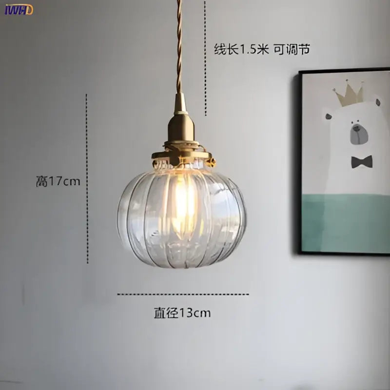 Teal glass ball pendant light with brass hardware for bedroom