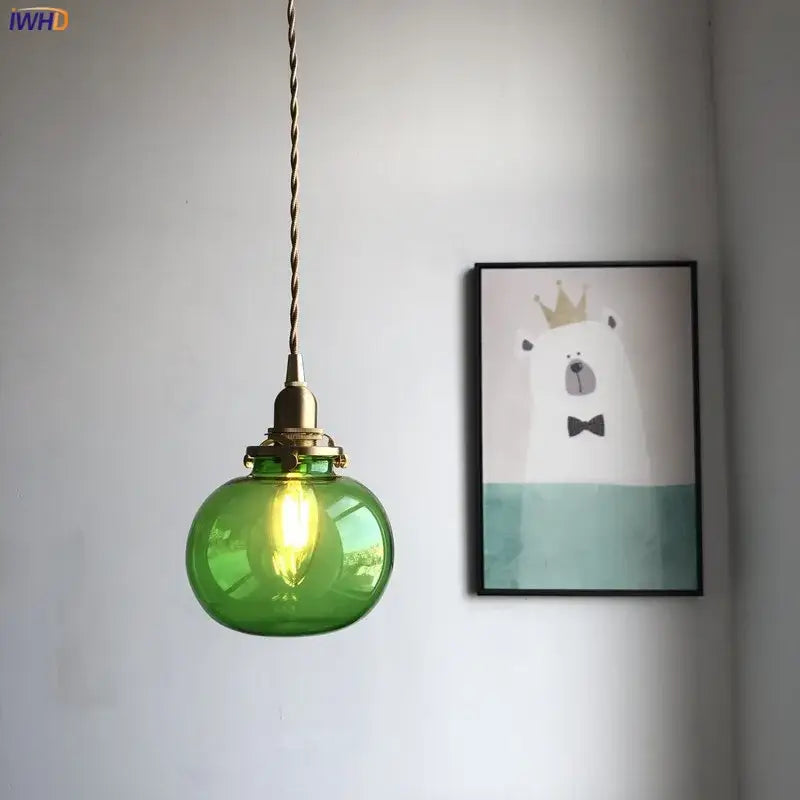 Teal glass ball pendant light with brass hardware for bedroom