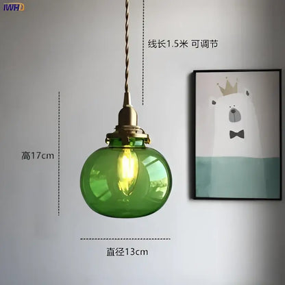 Teal glass ball pendant light with brass hardware for bedroom