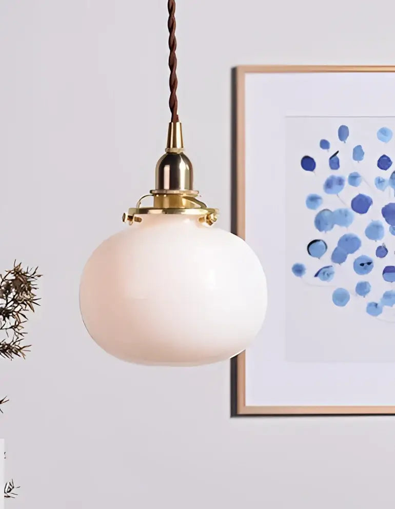 Teal glass ball pendant light with brass hardware for bedroom