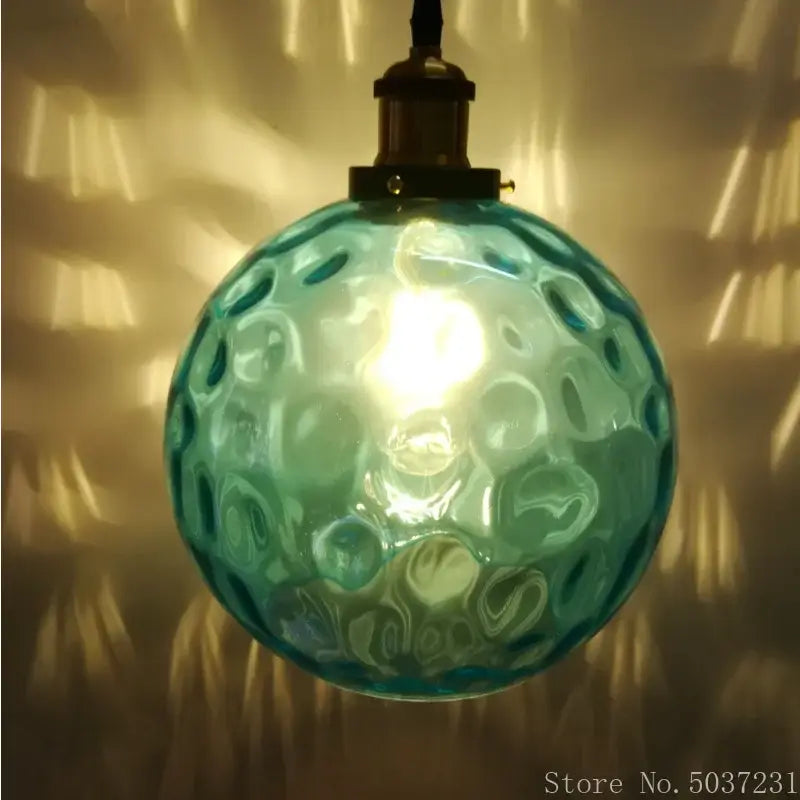 Textured blue glass ball pendant light for dining room
