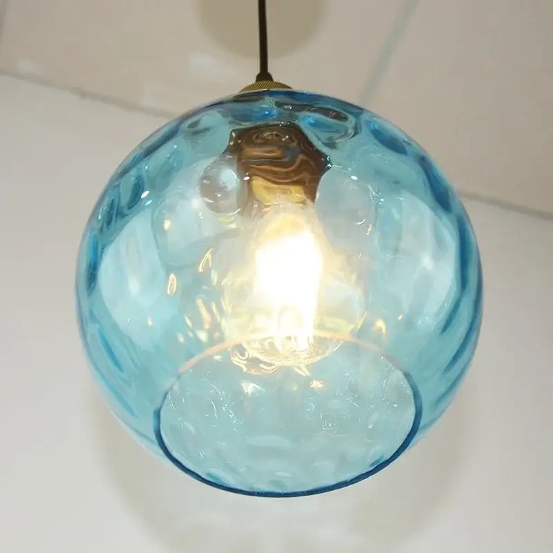 Textured blue glass ball pendant light for dining room