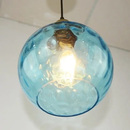 Textured blue glass ball pendant light for dining room