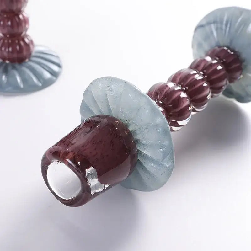 Textured burgundy and light blue glass candlestick holder dining room