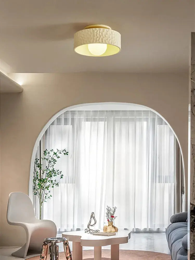 Textured cream ceiling light with gold trim for living room