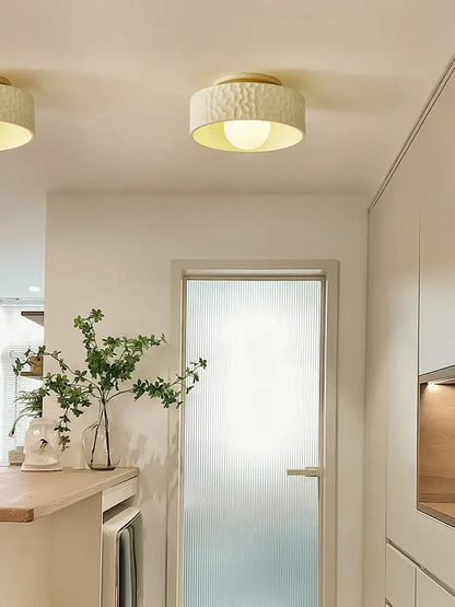 Textured cream ceiling light with gold trim for living room