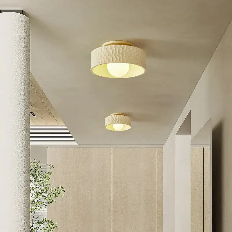 Textured cream ceiling light with gold trim for living room