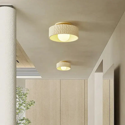 Textured cream ceiling light with gold trim for living room
