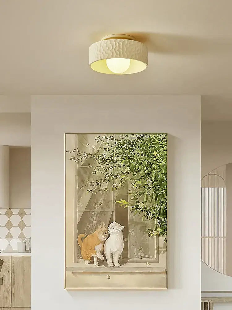 Textured cream ceiling light with gold trim for living room