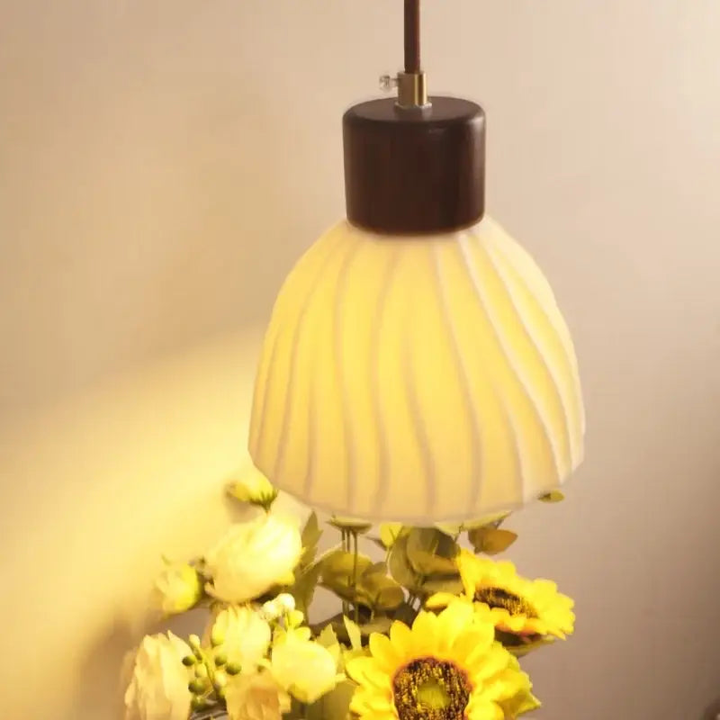 Textured glass and brass wall light fixture for dining room