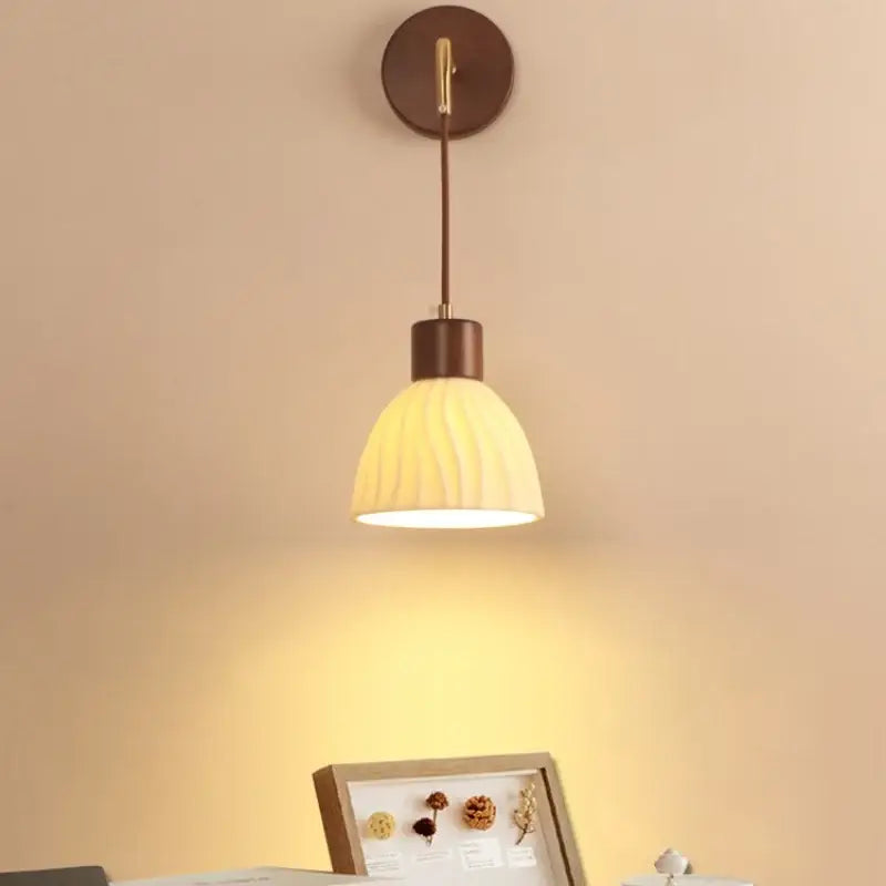 Textured glass and brass wall light fixture for dining room