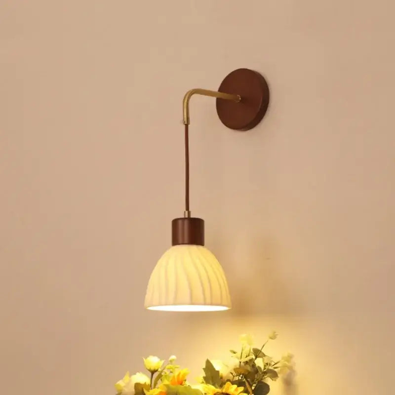 Textured glass and brass wall light fixture for dining room