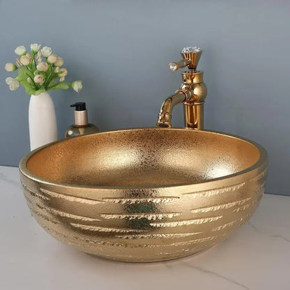 Textured golden ceramic bathroom basin set with ridged vessel sink
