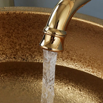 Textured golden ceramic bathroom basin set with ridged vessel sink