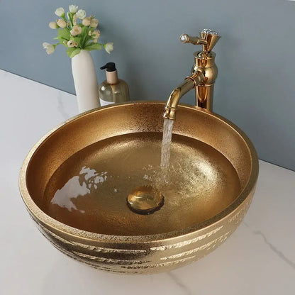 Textured golden ceramic bathroom basin set with ridged vessel sink