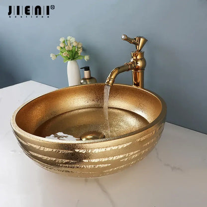 Textured golden ceramic bathroom basin set with ridged vessel sink