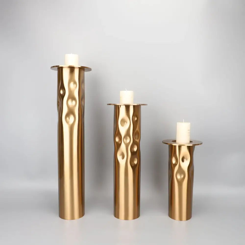 Textured golden metal candlestick holder set for dining room