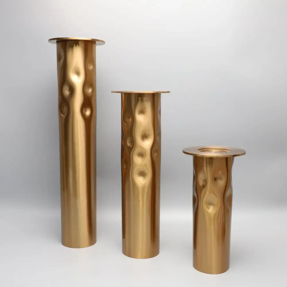 Textured golden metal candlestick holder set for dining room