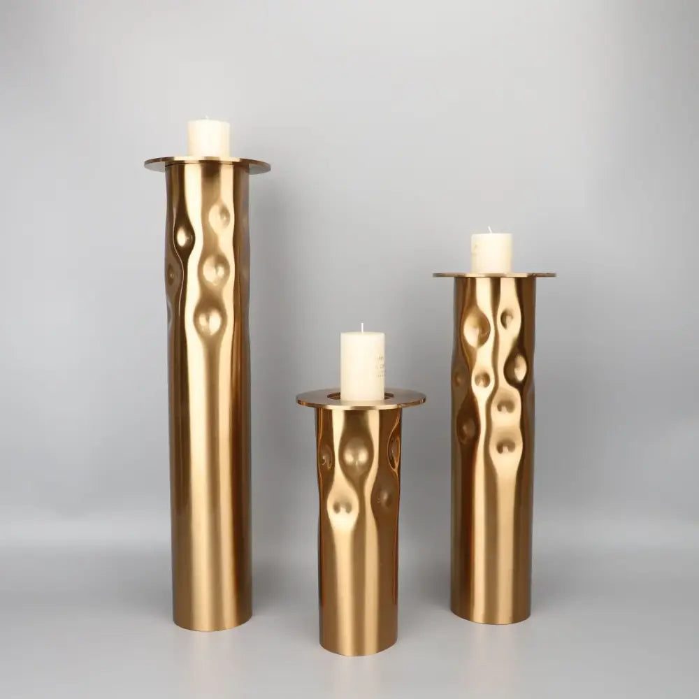 Textured golden metal candlestick holder set for dining room