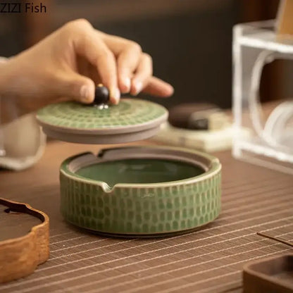 Textured green ceramic ashtray with wooden lid for office or living room