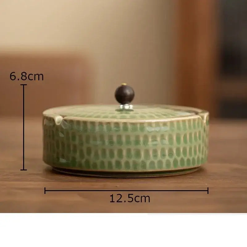 Textured green ceramic ashtray with wooden lid for office or living room