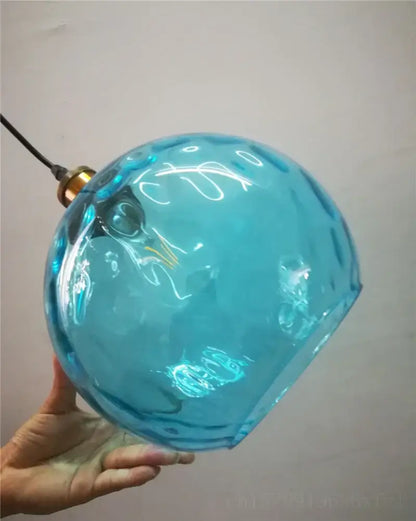 Textured turquoise blue glass ball pendant light for kitchens