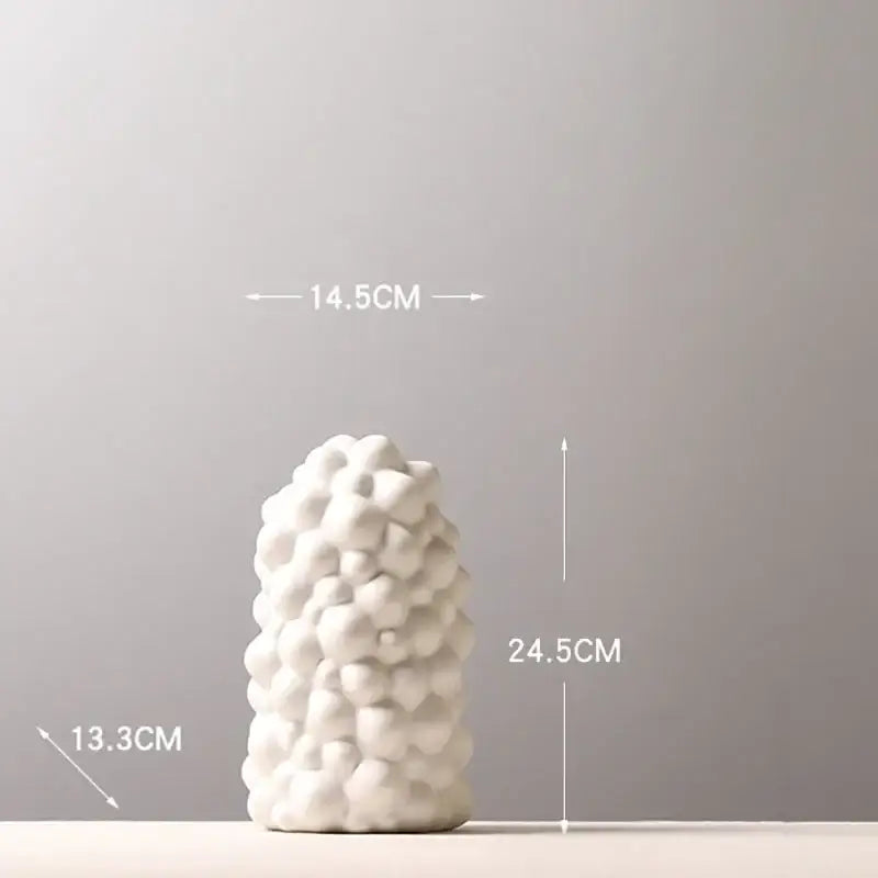 Textured white ceramic vase set with artificial flowers living room