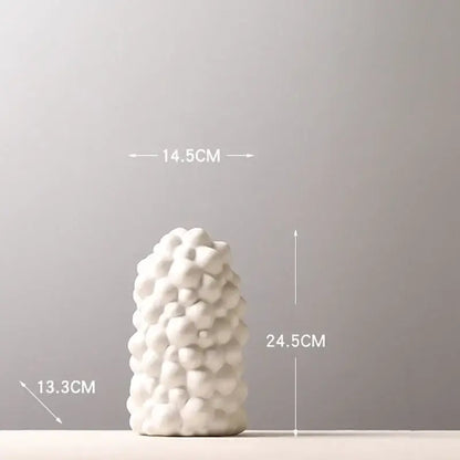 Textured white ceramic vase set with artificial flowers living room