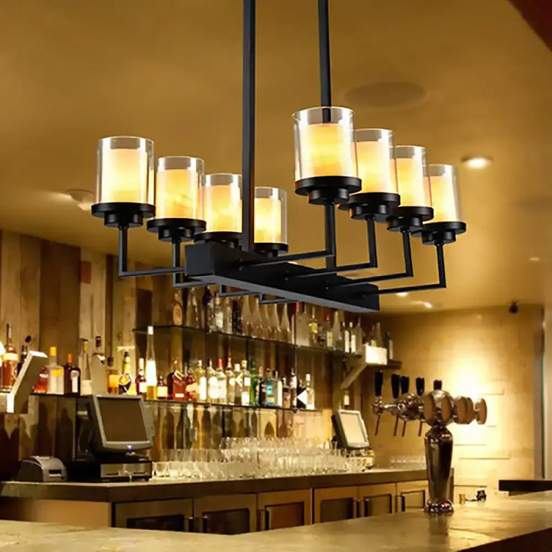 Traditional black cylinder dining room light with clear glass bulbs