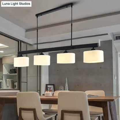 Traditional black drum island pendant with white shades dining room