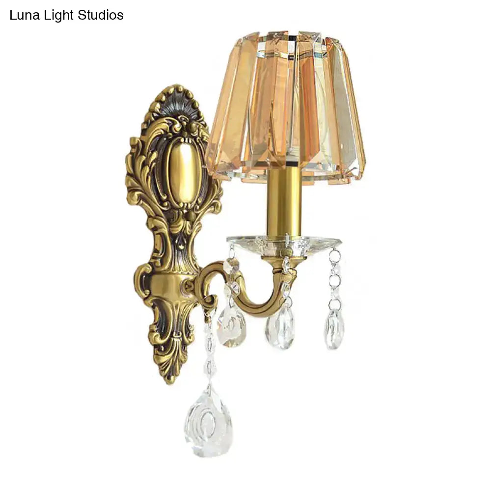 Traditional brass wall lamp with clear crystal shade living room