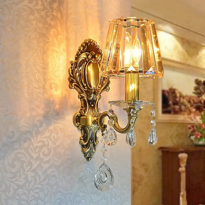 Traditional brass wall lamp with clear crystal shade living room