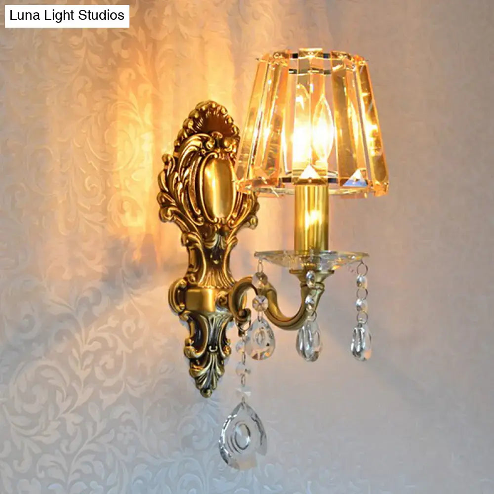 Traditional brass wall lamp with clear crystal shade living room