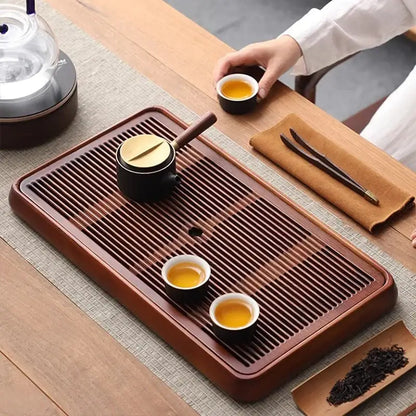 Traditional brown bamboo tea tray with water storage for dining room