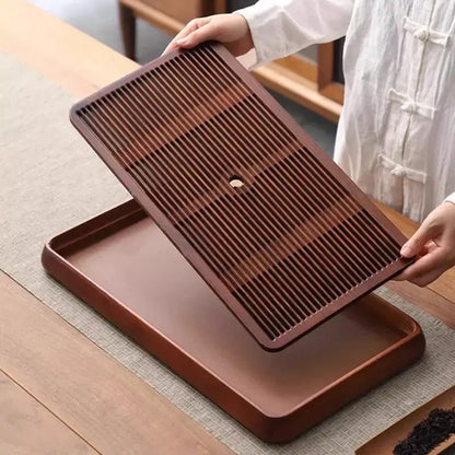 Traditional brown bamboo tea tray with water storage for dining room