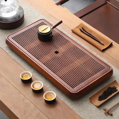 Traditional brown bamboo tea tray with water storage for dining room