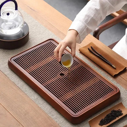 Traditional brown bamboo tea tray with water storage for dining room