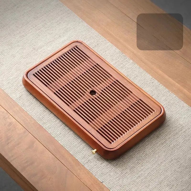 Traditional brown bamboo tea tray with water storage for dining room