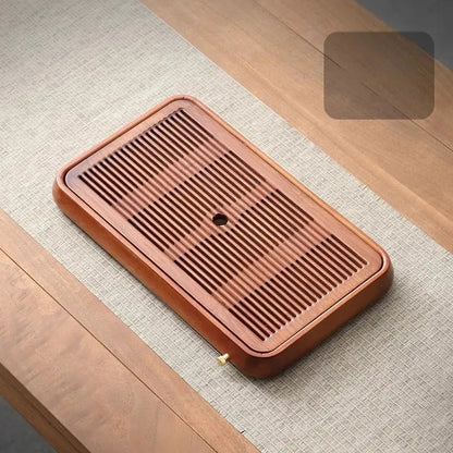 Traditional brown bamboo tea tray with water storage for dining room