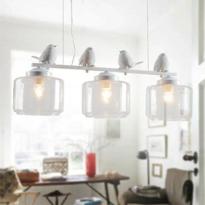 Traditional white ceramic bird and clear glass pendant dining room