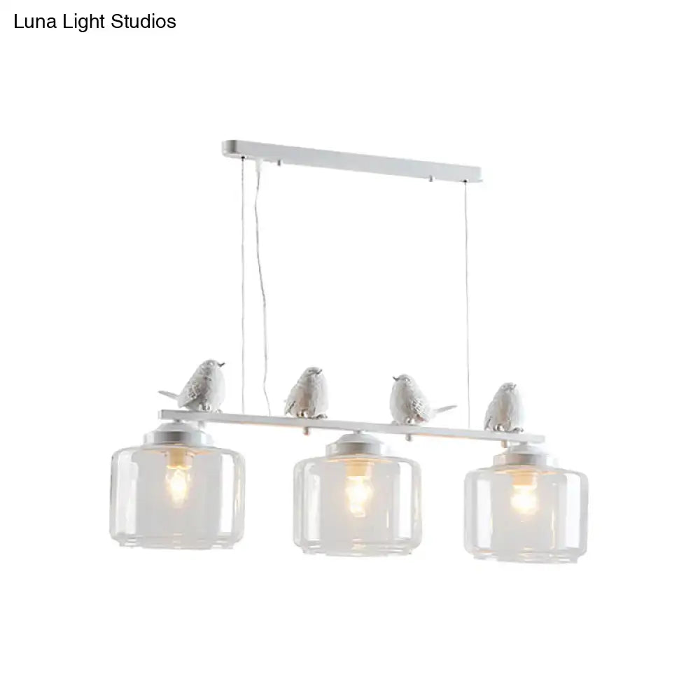 Traditional white ceramic bird and clear glass pendant dining room