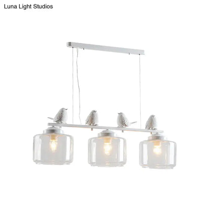 Traditional white ceramic bird and clear glass pendant dining room