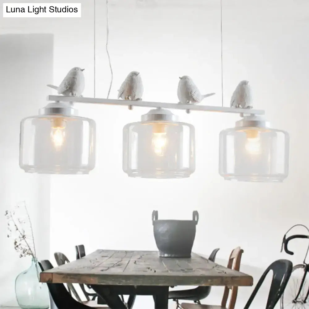 Traditional white ceramic bird and clear glass pendant dining room