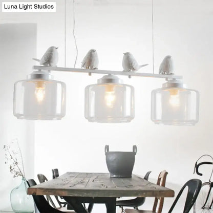 Traditional white ceramic bird and clear glass pendant dining room