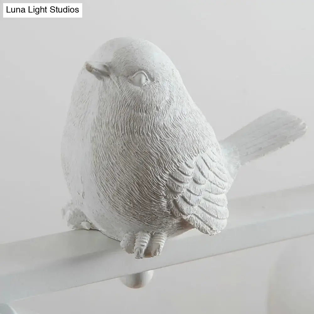 Traditional white ceramic bird and clear glass pendant dining room