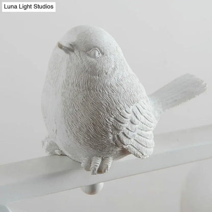 Traditional white ceramic bird and clear glass pendant dining room